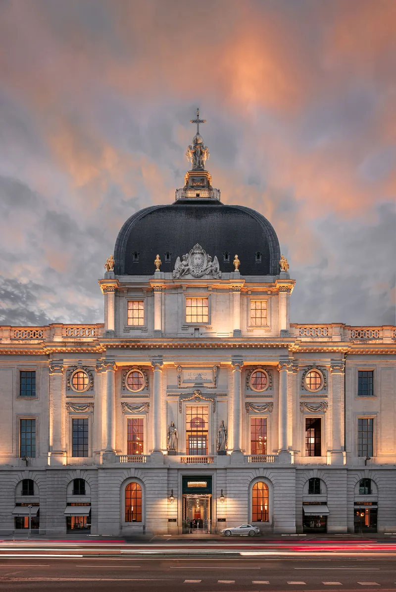 The illuminated dome of the Grand Hôtel-Dieu in Lyon at nightfall
