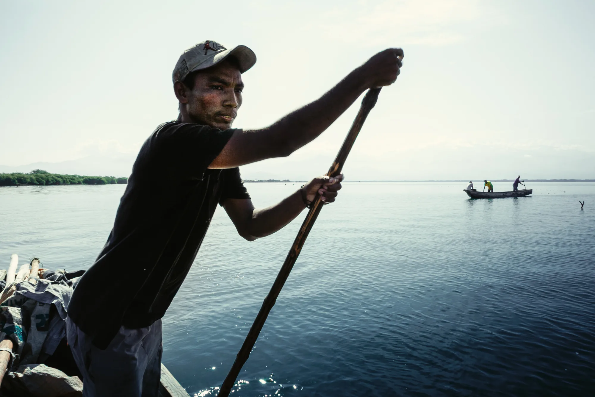 Boatman steering with his pole on a river, travel journal