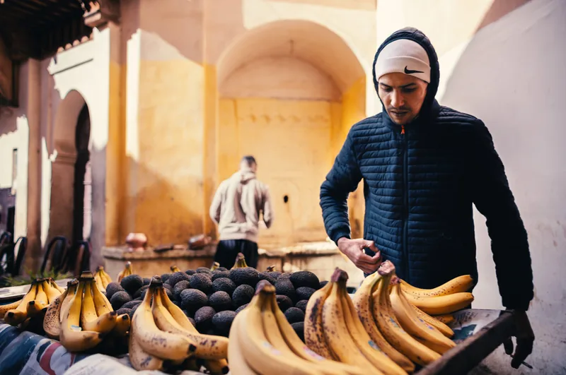 Banana seller beneath arcades