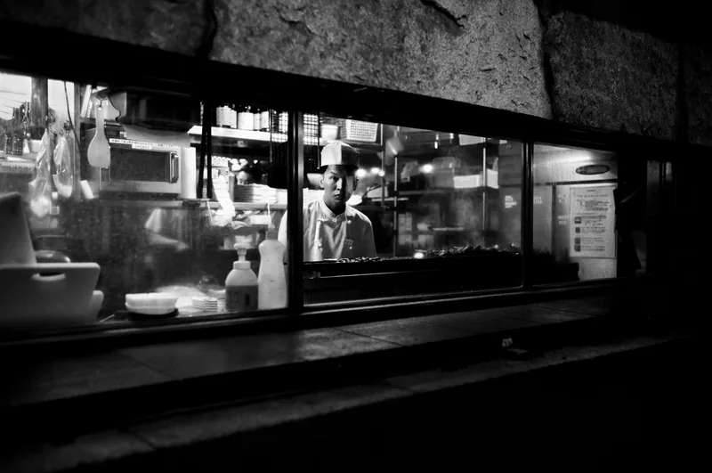 Illuminated shop window on a street at night